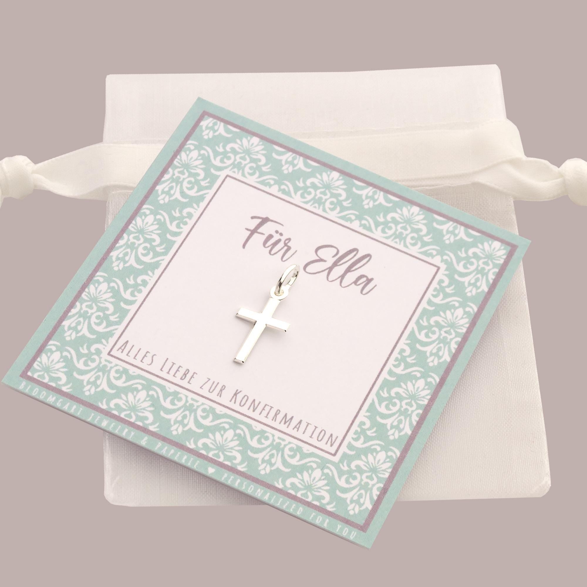 Filigraner Kreuz-Anhänger an einer Öse aus 925 Sterling Silber als Einzelanhänger zur Konfirmation auf einer personalisierten kleinen Karte mit Ornamentmuster in Wunschfarbe präsentiert.