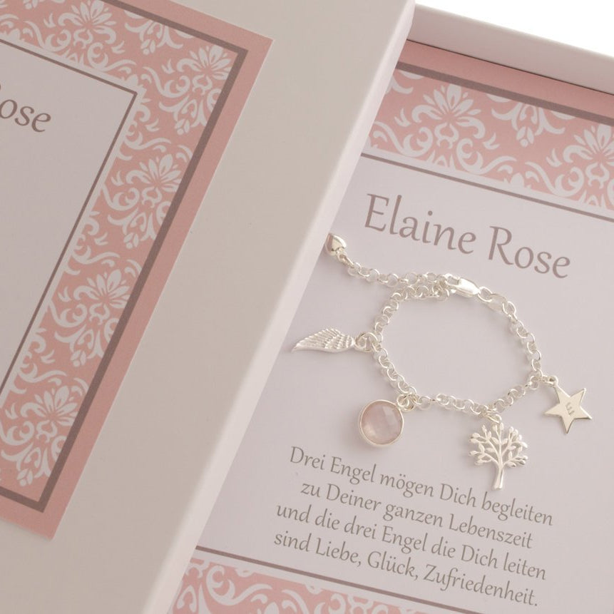 Ein zauberhaftes Gliederarmband mit Initial-Stern, Baum des Lebens, Rosenquarz und Engelsflügel als Geschenk fürs Patenkind, hier 'Elaine Rose' zur Taufe.